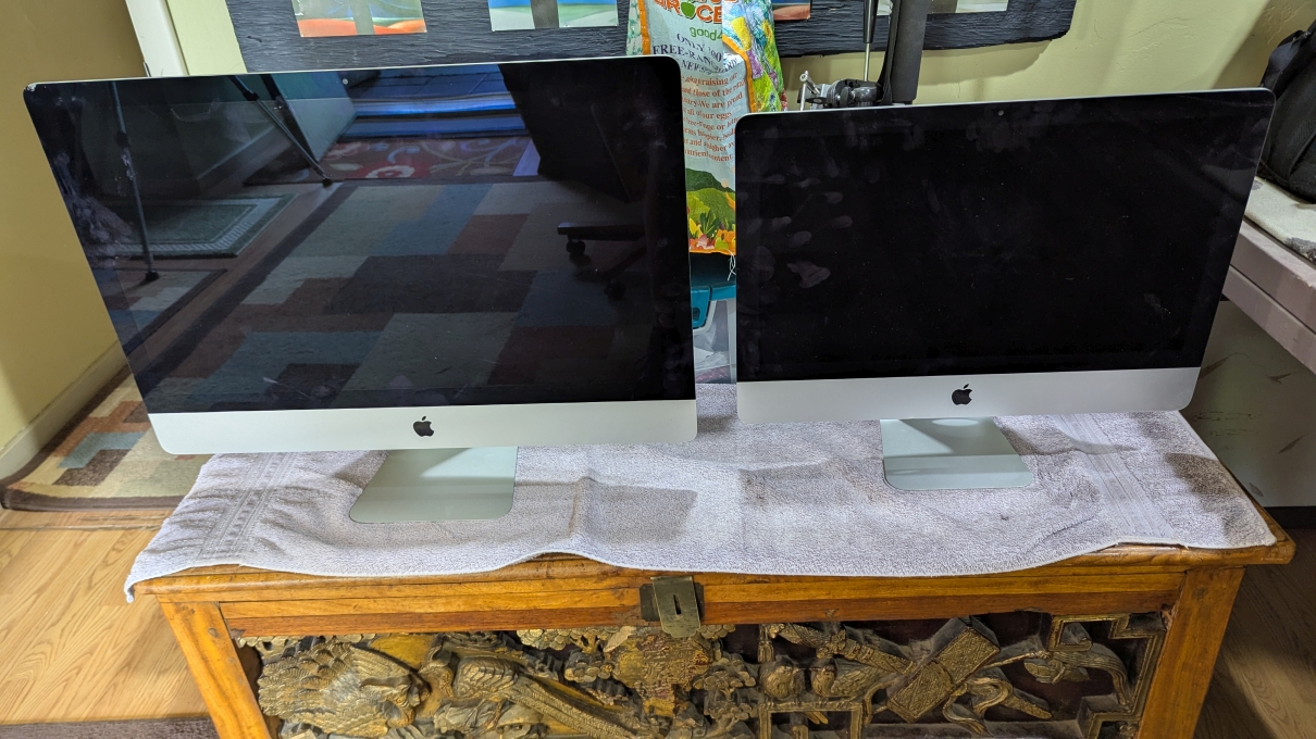 Two older Apple desktop computers ready for reuse as local server infrastructure